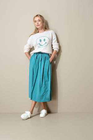 Knitted sweater with smiley face
