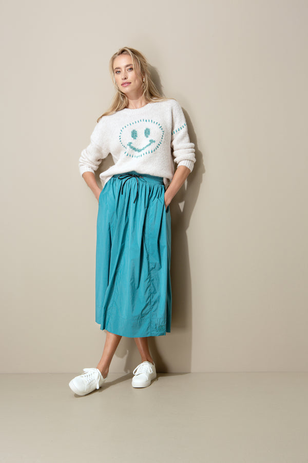 Knitted sweater with smiley face