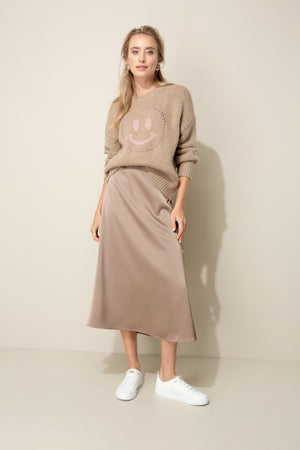 Knitted sweater with smiley face
